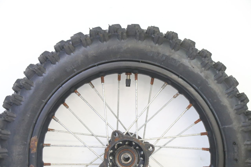 photo de ACHTERWIELVELG EN BAND ORION DIRT BIKE 125 - Zoom op gebruiksstaat